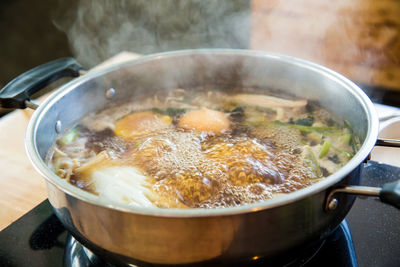 Close-up of meat in cooking pan