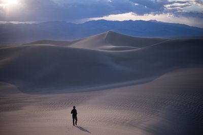 Scenic view of desert against sky during sunset