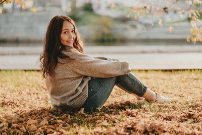 Young woman sitting outdoors