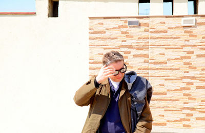 Person standing in front of building