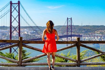 Rear view of woman looking at bridge