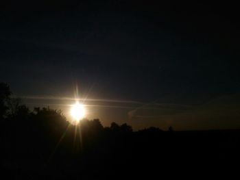 Scenic view of silhouette landscape against sky at sunset