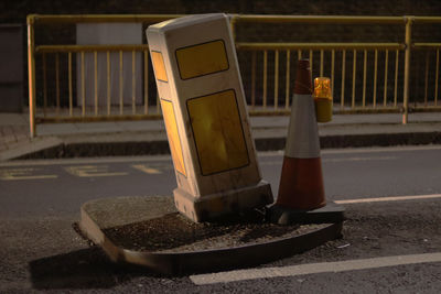 Traffic cone on road at night