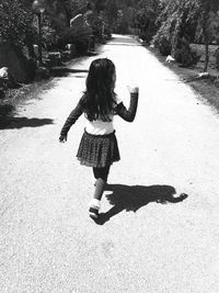 Girl standing on road