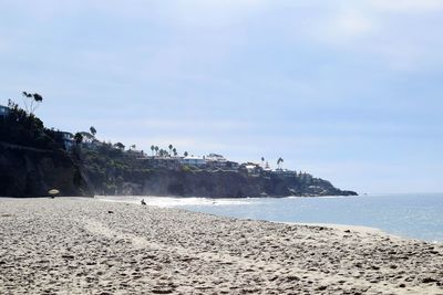 Scenic view of beach against clear sky