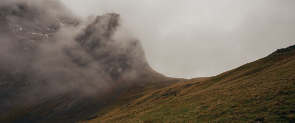 Scenic view of volcanic mountain against sky