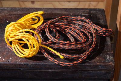 High angle view of rope tied on wood