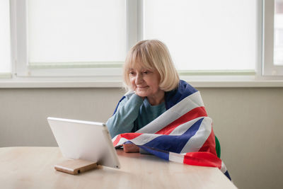 Young woman using laptop at home