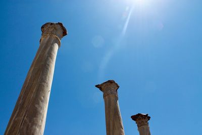 Low angle view of historical building against blue sky