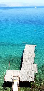 High angle view of pier on sea against sky