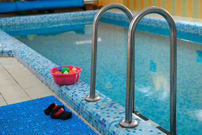 Empty indoors public swimming pool for kids. sports balls. children center, pool with children