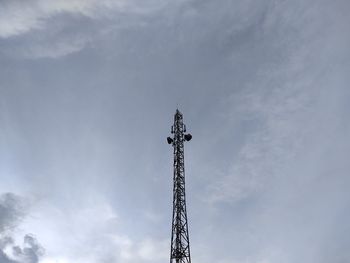 Low angle view of communications tower against sky