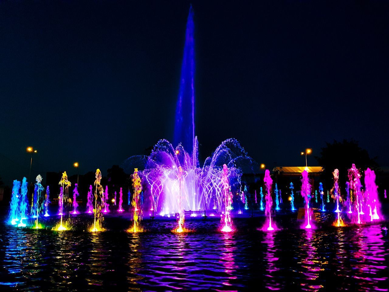 FIREWORK DISPLAY OVER WATER FOUNTAIN