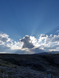 View of countryside landscape against blue sky