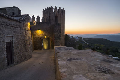 View of historic building against sky during sunset