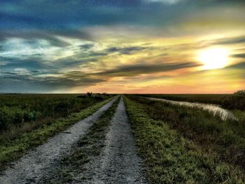 Road passing through field