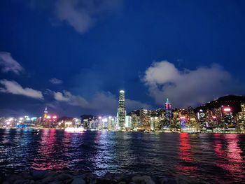 Illuminated city at waterfront