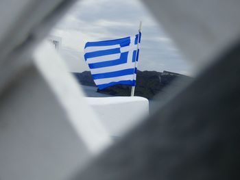 Close-up of flag against sky