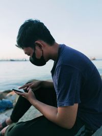 Young man using mobile phone