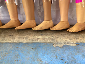 Low section of people standing on street