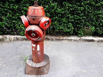 Red fire hydrant on footpath