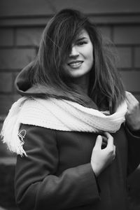 Close up smiling lady in coat with scarf monochrome portrait picture