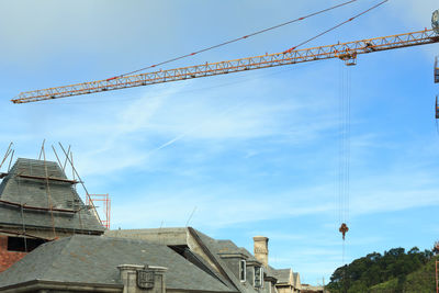 Low angle view of construction site against sky