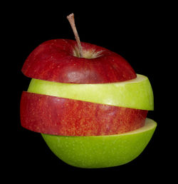 Close-up of apple against black background