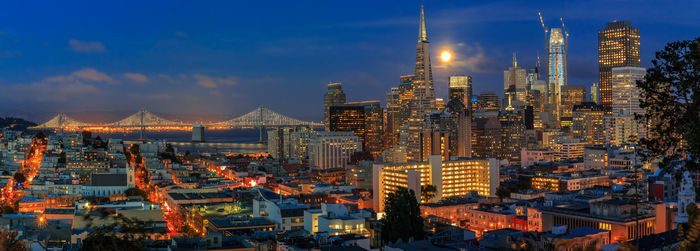 High angle view of illuminated cityscape against sky