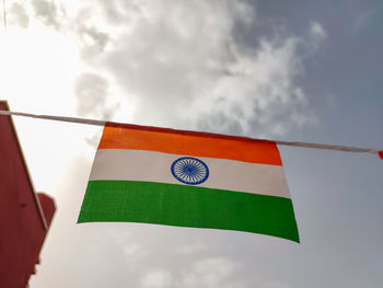 Low angle view of flag against sky