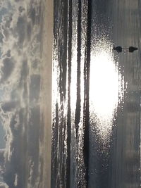 Close-up of frozen sea against sky