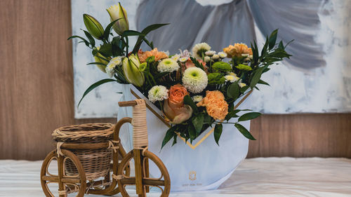Potted plants in basket on table