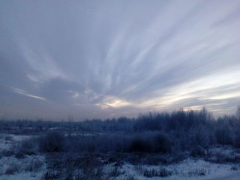 Scenic view of landscape against sky during winter