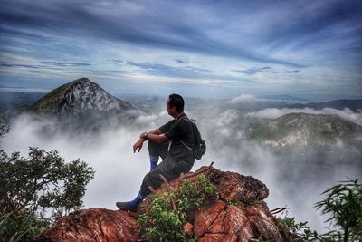 Full length of man on rock against sky