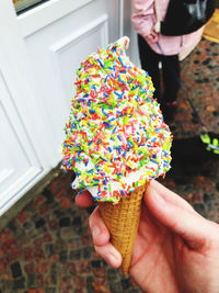 Midsection of person holding ice cream