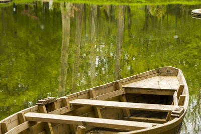 Boat in pond in the park, zugdidi botanic garden in georgia. springtime.