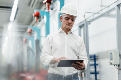 Man working on mobile phone