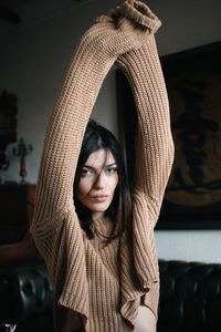 Portrait of woman wearing a beige shirt