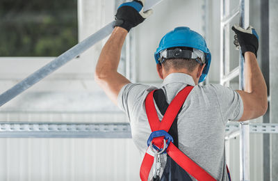 Rear view of man working