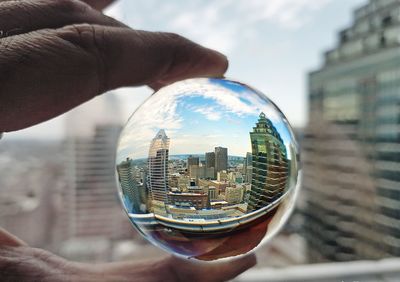 Downtown montreal through a glass ball