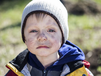 Close-up of boy with dirt on face
