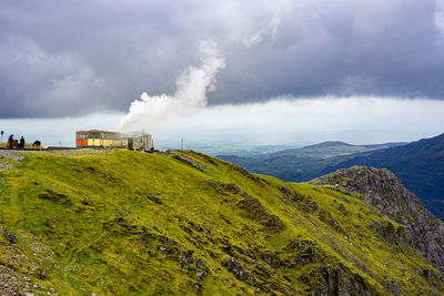 Clouds pouring over and around the mountain over sixt-fer-a-cheval