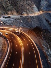 High angle view of illuminated road at night