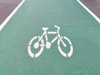 High angle view of bicycle sign on road