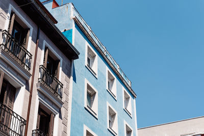 Low angle view of building against blue sky