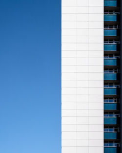 Low angle view of building against blue sky