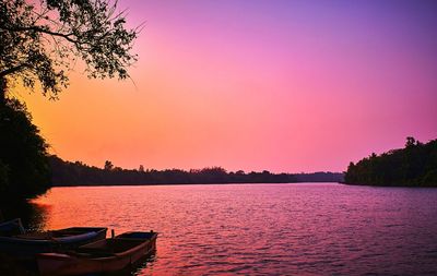 Scenic view of lake at sunset