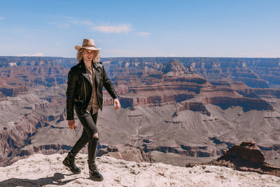 Full length of man standing on rock