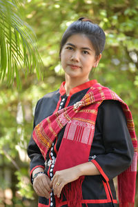 Portrait of woman standing outdoors