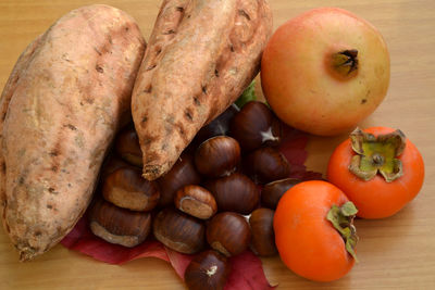 Close-up of vegetables and nuts on wooden table